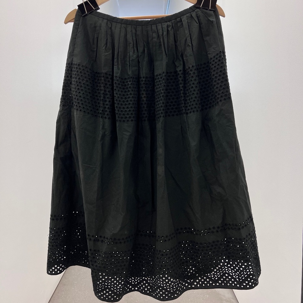 black skirt with lace hole details